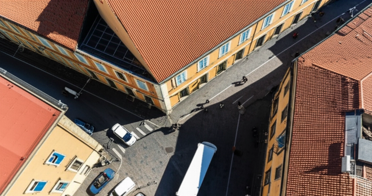 Vista aerea iperrealistica di un furgone per traslochi parcheggiato nel centro storico di Sassari.